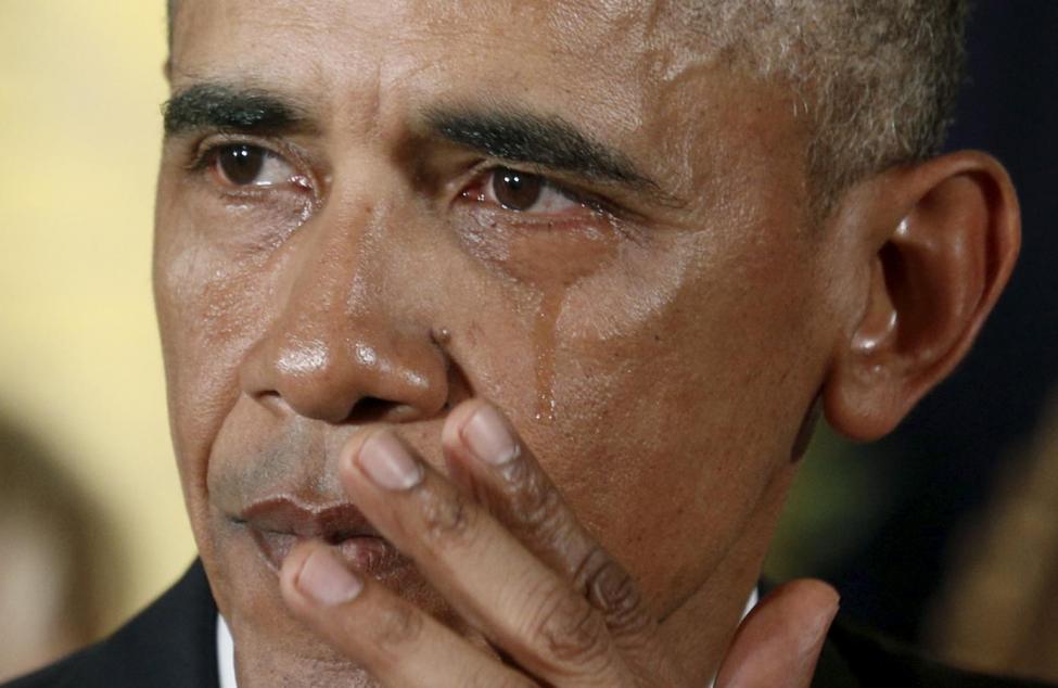 President Obama wipes a tear. REUTERS/Kevin Lamarque